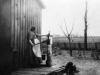 02-I-3.5 Woman beside White family water pump